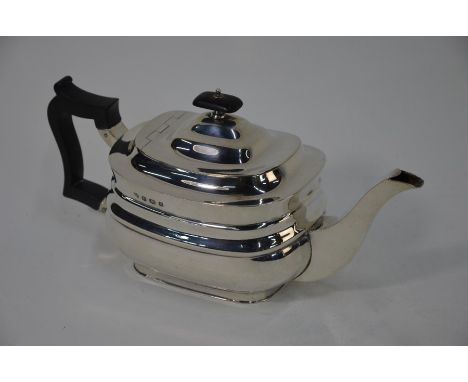 A Regency-style silver teapot of oblong form, with composite finial and handle, William Hutton &amp; Son Ltd, Sheffield 1927,