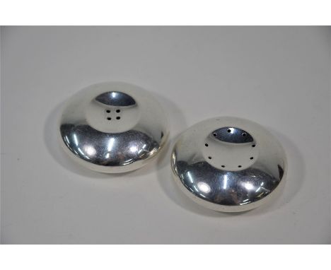 A pair of Danish sterling salt and pepper of 'button' form, designed by Hans Heusen for Cohr of Fredericia, 4.7 cm diam
