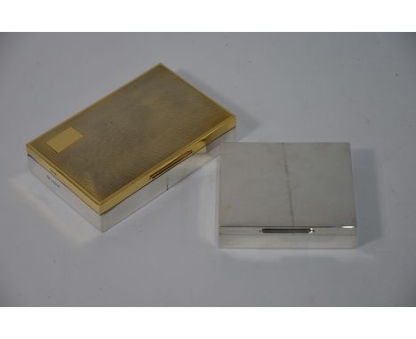 A silver cigarette box with engine-turning and gilt top, Bishton's Ltd, Birmingham 1978, 15 cm wide to/w a smaller plainer ci