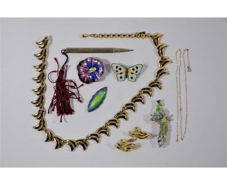 A Monet gilt metal necklace and earring set, two polychrome enamel brooches in the form of a pansy and butterfly, an Arts &am