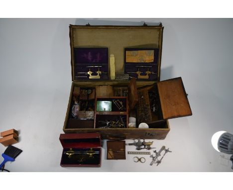 A good selection of 19th century and later watchmaker's tools - mostly brass and steel, etc, in a vintage suitcase