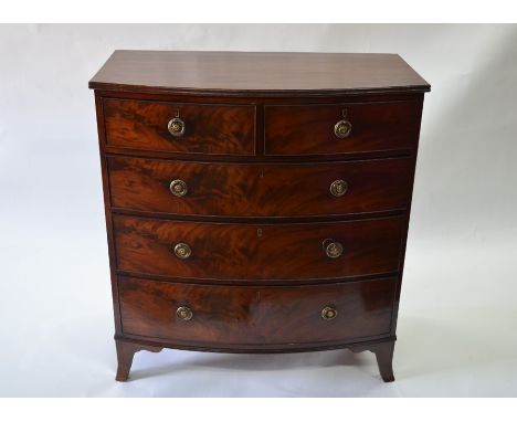 A Victorian mahogany bow front chest of two short over three long graduated drawers raised on splay bracket feet, 100 cm wide