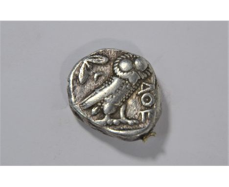 A coin in the manner of an Ancient Greek coin, featuring owl and head, approx 16.6g&nbsp;