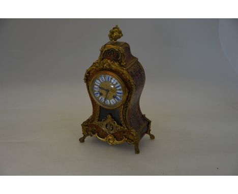 A brass and gilt metal mounted boulle style mantel clock, the two train eight-day movement stamped 'GF' with gilt dial and wh