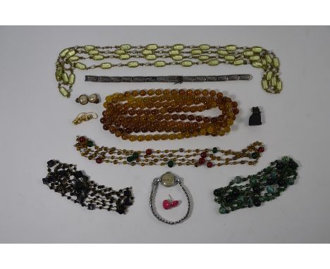 A collection of various vintage bead necklaces, black cat charm, pair of yellow metal earrings, wristwatch etc