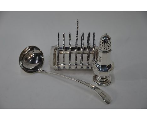 An octagonal silver sugar caster on weighted foot, Birmingham 1940 to/w an electroplated soup ladle and toast rackCaster lack