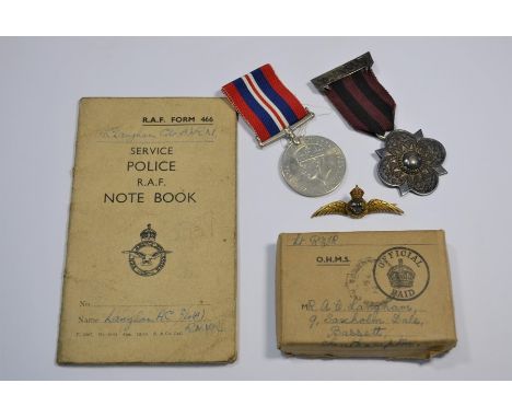 A 9ct gold Fleet Air Arm lapel badge, 4.5g to/w a 1939-45 Medal to Lt (RNVR) A C Langham, his Service Police RAF Notebook and
