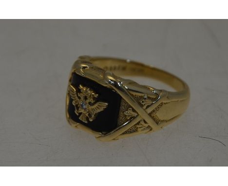 A signet ring, the 14ct yellow gold fancy ring with onyx and diamond set centre, size Y, approx 15.5g all inLight scratching 