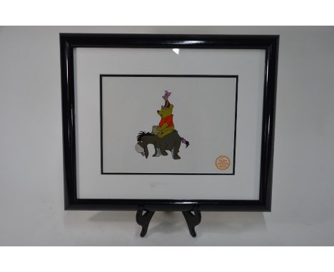 A Disney animation serigraph of Winnie the Pooh, riding in Eeyore, holding a honey pot and with piglet sitting on his head, 2