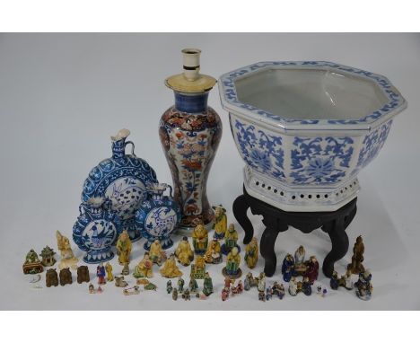 A collection of Asian ceramics including a Chinese blue and white octagonal jardiniere on hardwood stand, a 19th century Imar