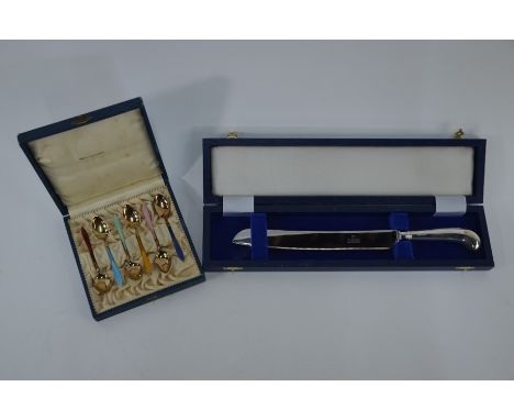 A cased Harlequin set of six Norwegian silver gilt and enamel coffee spoons by David Andersen, to/w a cased bread knife with 