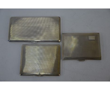 Three heavy quality silver Art Deco style engine-turned cigarette cases, Birmingham 1954/67/70, 19.4 oz total