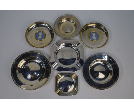 Three silver reproduction Armada dishes, two silver ashtrays and two silver trinket dishes inset with Charles and Diana Wedgw
