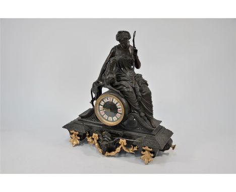 A 19th century continental bronzed spelter mantel clock, the two train drum movement surmounted by a seated 'Diana the Huntre