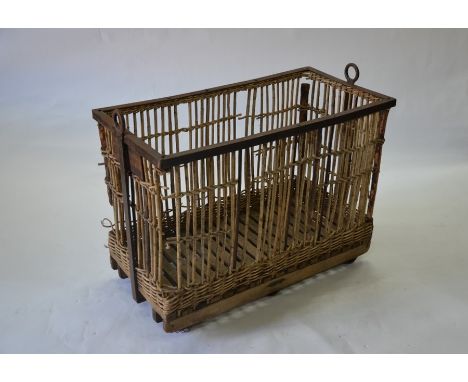 A vintage steel framed wicker and stick laundry trolley, 102 x 52 x 78 cm high overall