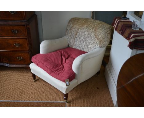 A Howard deep armchair, Bridgwater model circa 1900, raised on mahogany square tapering supports to original brass castors, w