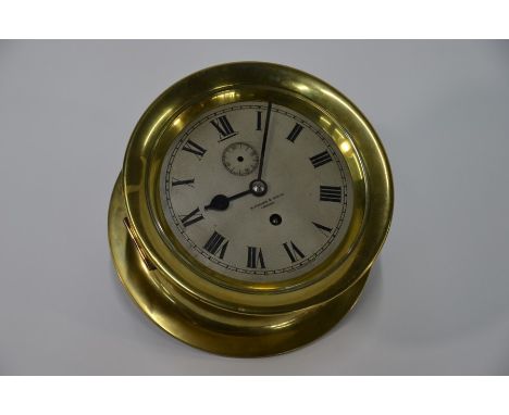 H Hughes &amp; Son Ltd, London, a brass cased single fusee bulkhead clock with silvered dial and subsidiary seconds (not func