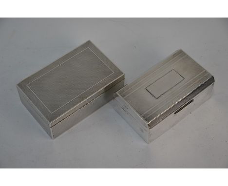 An engine-turned silver cigarette box, A & J Zimmerman, Birmingham 1935, 15 cm wide to/w another Art Deco cigarette box, W T 