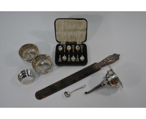 An Edwardian tortoiseshell page-turner with embossed silver handle, London 1904, 42 cm long overall, to/w a pair of stemmed b