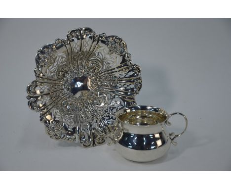 An Edwardian pierced silver bonbon bowl with embossed and chased floral decoration, Charles Westwood &amp; Sons, Birmingham 1