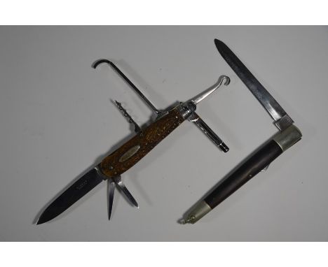 A vintage steel multi-functional folding knife with nine tools, two-piece antler grip, by Gilles of London to/w a pocket knif