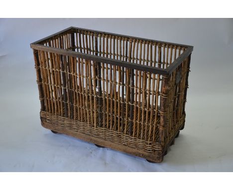 A vintage steel framed wicker and stick laundry trolley, 102 x 52 x 78 cm high overall