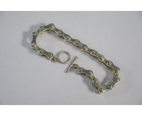 A white metal bracelet in the form of a bicycle chain with ring and bar fastening, 23 cm long, approx 73g