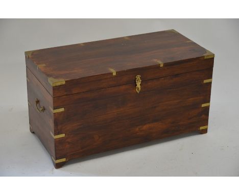 A Victorian style brass bound hardwood trunk on bracket feet 84 x 40 x 45 cm