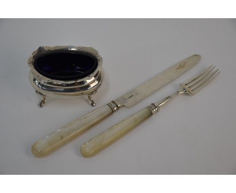 A George III silver dessert knife and fork with mother of pearl handles, Moses Brent, London 1811 to/w a silver open salt wit