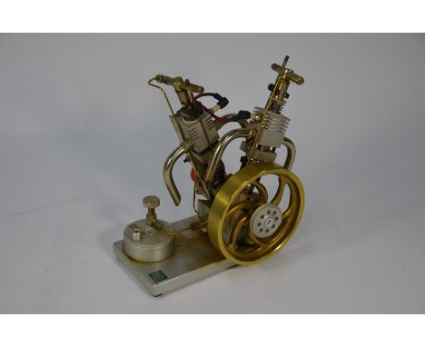 A Maier Mechanic two-cylinder working model gas engine, 23 cm highMechanical parts moving freely, rubber caps split but gener