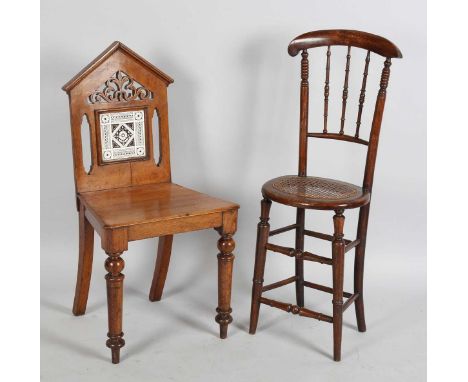 A mid-Victorian stained beech correction chair with finely turned spindle back and caned seat, height 97cm, width 34cm, toget