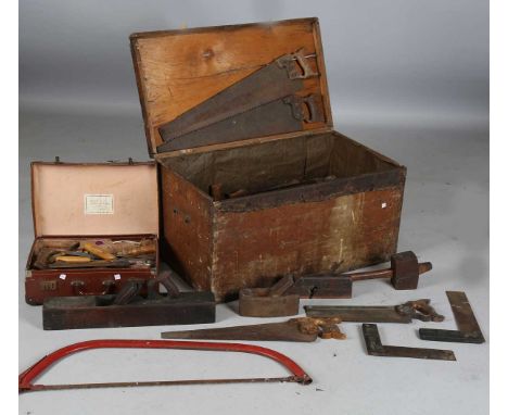 A quantity of woodworking tools, including various saws, planes and chisels.