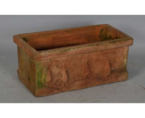 A 20th century terracotta rectangular planter, the exterior moulded with cypress trees, height 25cm, width 58cm, depth 28cm.