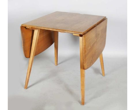 An Ercol elm drop-flap breakfast table, height 71cm, extended length 137cm, depth 74cm.