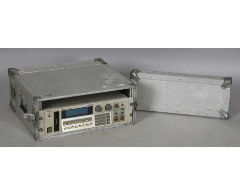 An Akai S1000 Midi Stereo Digital Sampler, together with aluminium flight case.