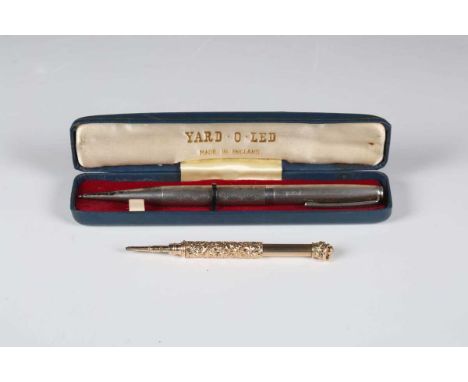 A Yard-O-Lead silver cased propelling pencil with engine turned decoration, Birmingham 1973, with instructions and a case, to
