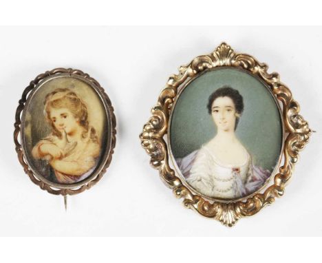 A 19th century half-length portrait miniature of a lady, watercolour on ivory, 3.7cm x 3.1cm, mounted within a gold frame wit