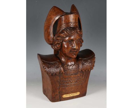 A 20th century carved oak portrait bust of Anne Boleyn, bearing titled plaque, height 35cm.
