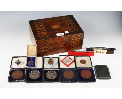 A group of five early 20th century Cripplegate Institute gymnastic award medallions, cased, a small group of other awards, a 