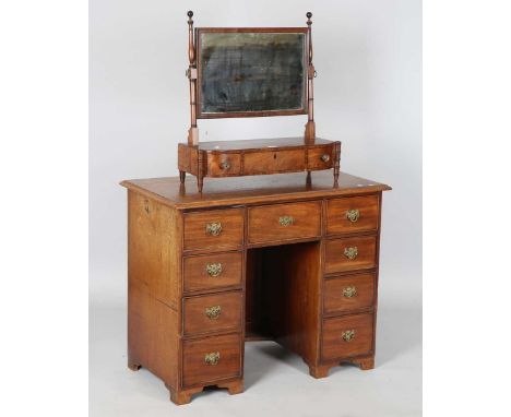 A 19th century mahogany swing frame toilet mirror, the rectangular plate glass above three drawers, on ring turned supports, 