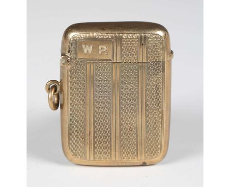 A 9ct gold curved rectangular vesta case with engine turned decoration, the front with the initials ‘W.P’, Birmingham 1925, w