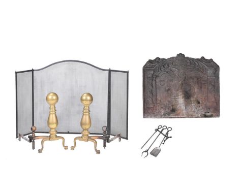 A MONUMENTAL PAIR OF BRASS AND IRON ANDIRONS 19TH CENTURY  each 75cm high TOGETHER WITH A CAST IRON FIREBACK ENGLISH, 17TH CE