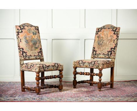 A MATCHED PAIR OF CHARLES II WALNUT AND NEEDLEWORK UPHOLSTERED SIDE CHAIRS LATE 17TH CENTURY With close nailed woolwork uphol