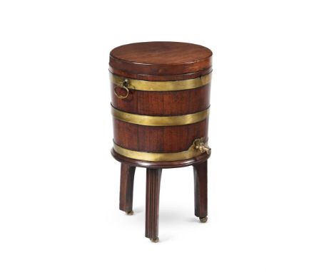 A GEORGE III MAHOGANY AND BRASS BOUND WINE COOLER  CIRCA 1780 Of coopered cylindrical form, the lid enclosing a divided inter