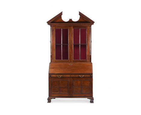 AN EARLY GEORGE III MAHOGANY BOOKCASE IN THE MANNER OF WILLIAM HALLETT, CIRCA 1765 With brass side handles, the fall enclosin