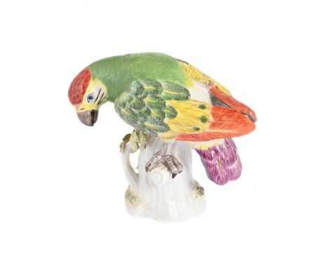 A MEISSEN MODEL OF A PARROT SECOND HALF 20TH CENTURY Typically modelled perched on a stump, blue crossed swords mark, incised