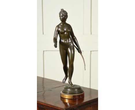 AFTER JEAN ANTOINE HOUDON, A BRONZE FIGURE OF DIANA THE HUNTRESS   CIRCA 1900  Titled to plinth  63cm high overall   Conditio