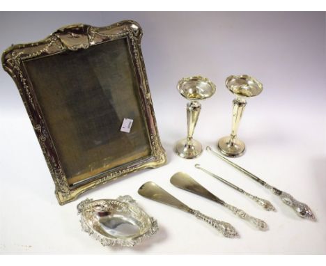 An early 20th century silver photograph frame, repousse swags and bows, Birmingham 1911; a pair silver bud vases; a silver sw