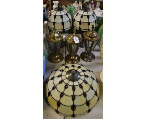 A pair of Art Deco style table lamps; a similar ceiling shade; three further table lamps, as brass lanterns (6)