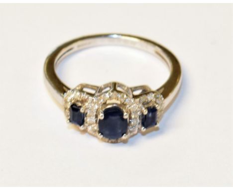 A 9ct white gold sapphire and diamond ring, in the Art Deco style